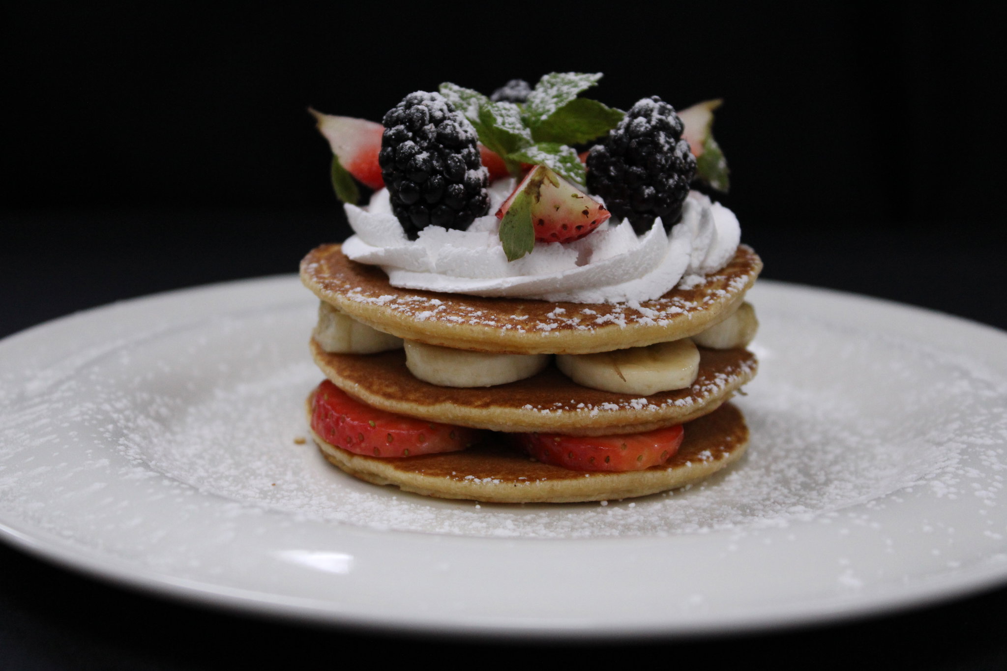 Pancakes with Strawberries, Bananas & Topped with Whipped Cream_0