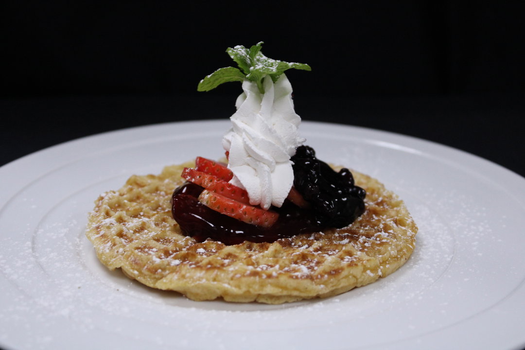 Waffles with Strawberries, Blueberries, Peaches, Topped with Whipped Cream