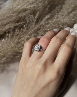 OVAL SOLITAIRE W/ DIAMOND RING