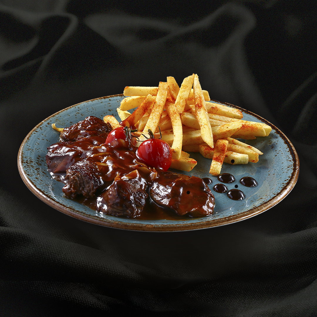 Beef in sweet and sour sauce and French fries