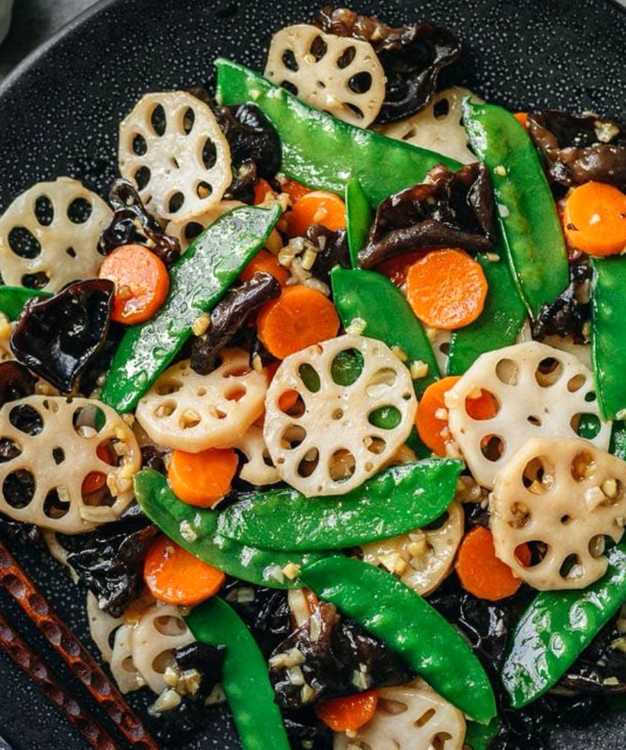 Stirfry Garlic, lotus, green pea, black Fungus, carrot W oyster sauce