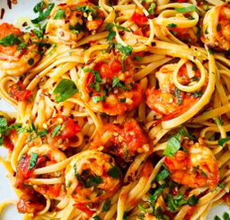 Sautéed Butter garlic prawns W fresh herbs N tomato N Shittake mushrooms fettuccine 