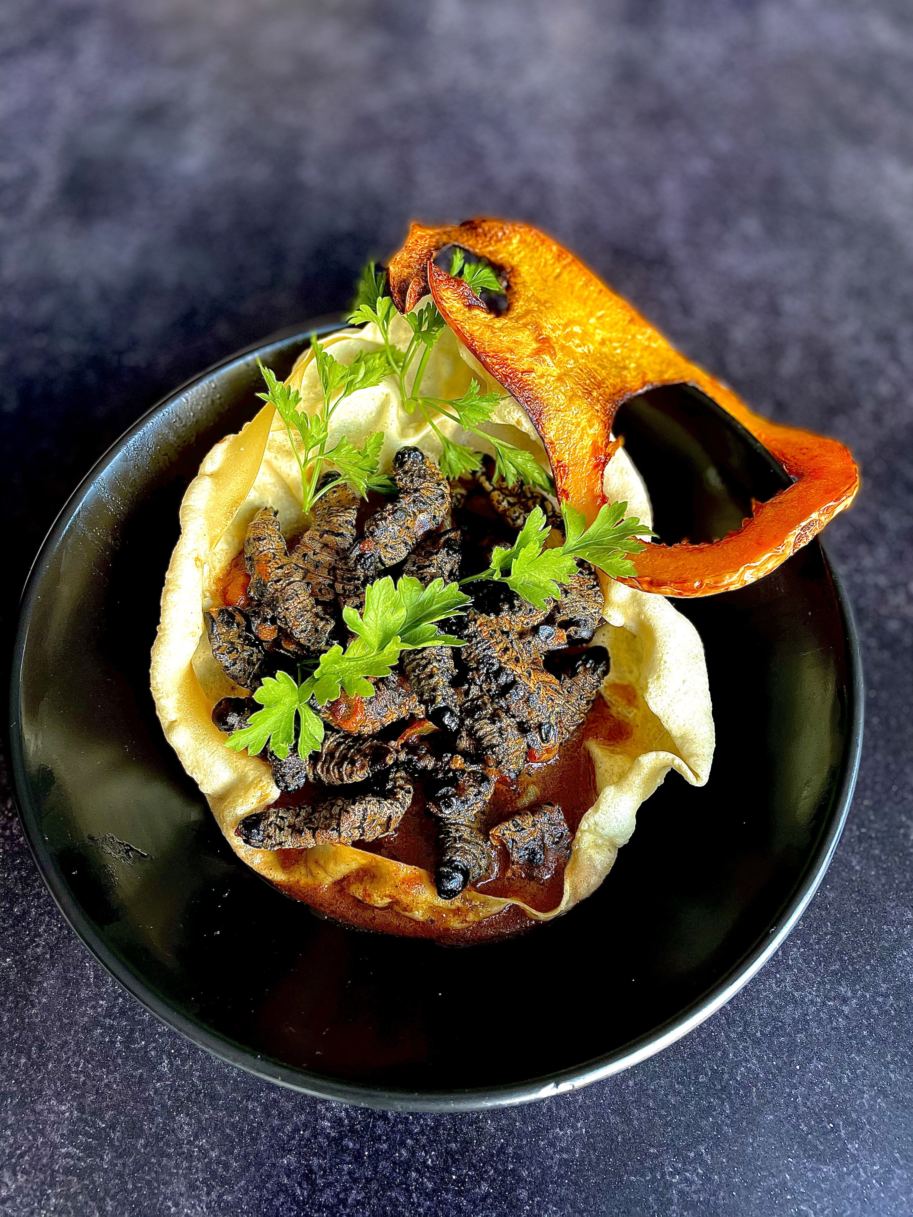 Masonja[ Mopani Worms]  served crispy & dry or with added tomato gravy.