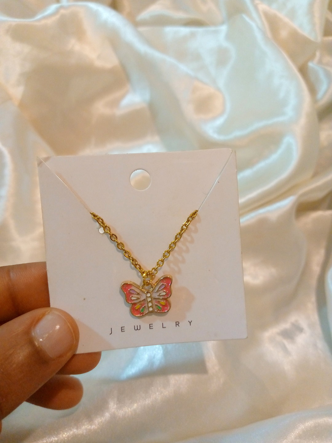Butterfly crest necklace
