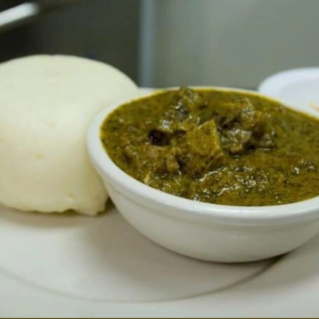 Rwandan Food Isombe with meat and ugali