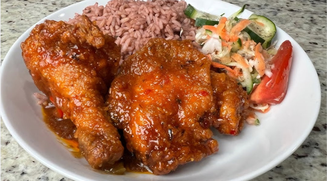 Barbe Fry Chicken & Porks Chops Served with RIce & Peas, Toss Salad, Peppered Corn on the Cob & Water