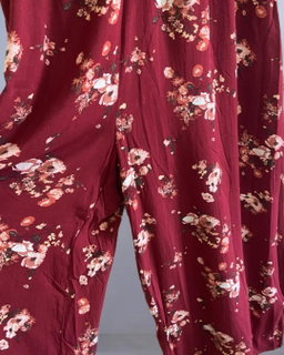 Floral Print Sleeveless V-Neck Smocked Waist Button-Front Jumpsuit.