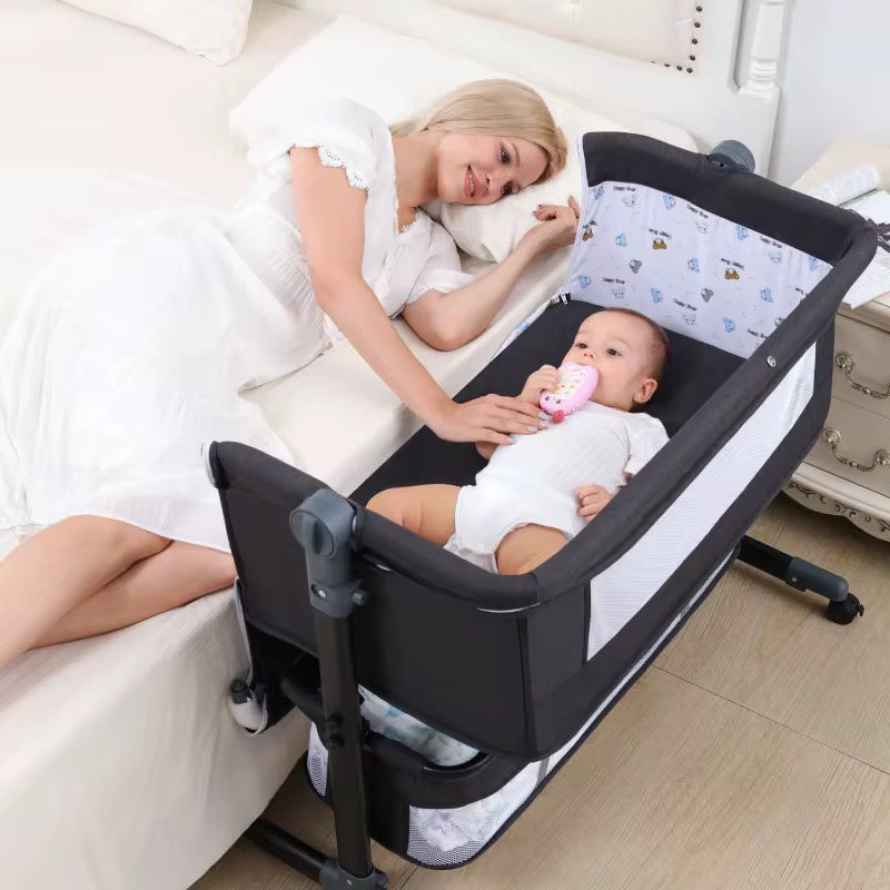 Baby besides crib bed _5