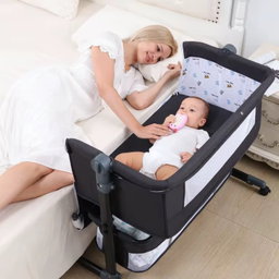 Baby besides crib bed 