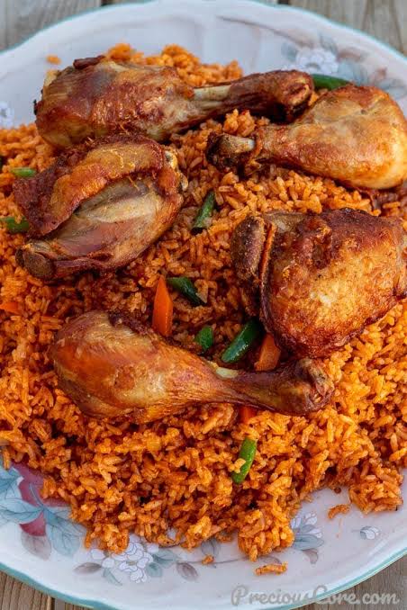 Two spoon of Jollof rice  with 1 beef 