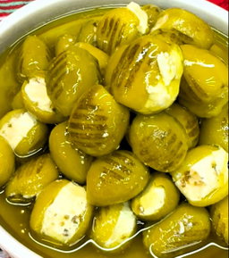 Grilled Green Olives Stuffed With Labnah Dipped in Olive Oil