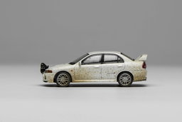MOTOR HELIX MODEL 1/64 MITSUBISHI LANCER EVO 4 - MUDDY VERSION WITH RALLY LIGHT