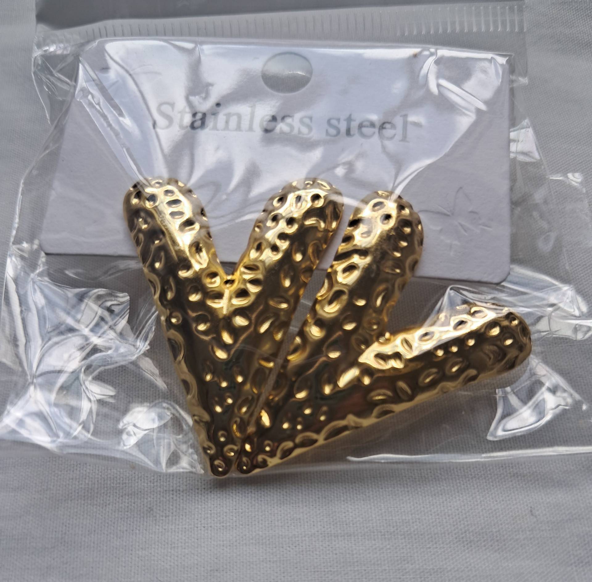 Aretes en acero inoxidable en forma de V_0