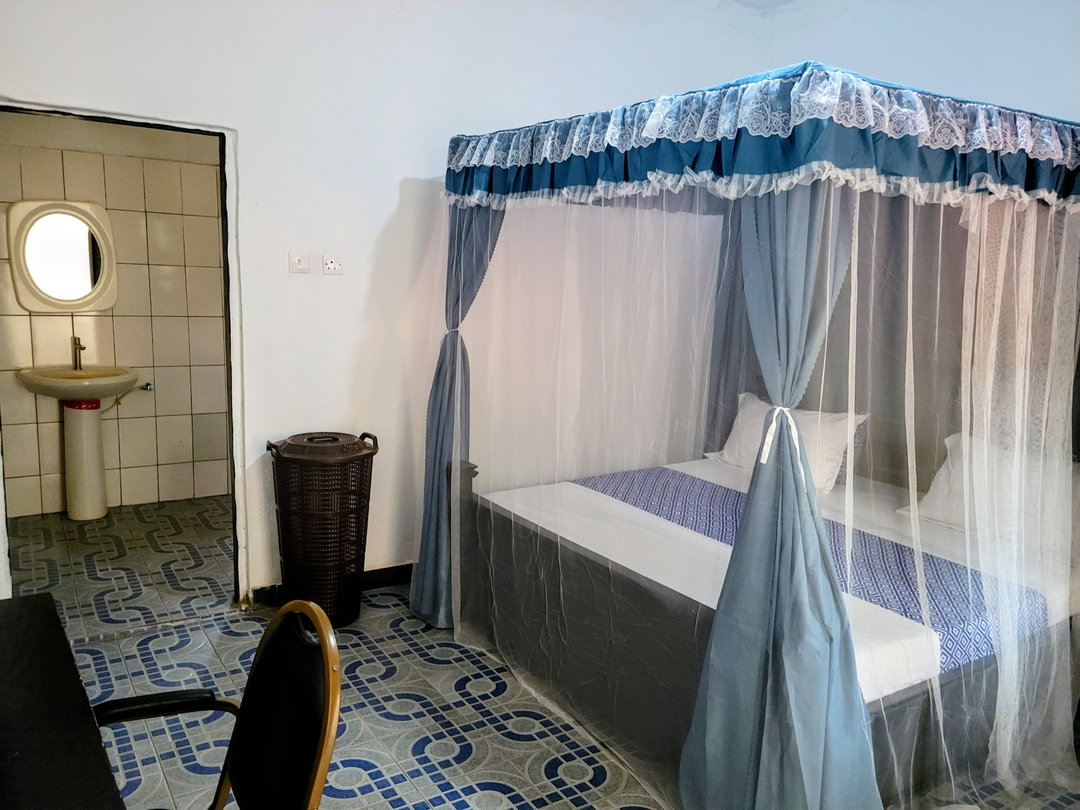 Standard Room with Fan, including breakfast for two people, bedroom fridge, 32" smart TV,  King size mosquito tent & internet