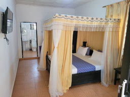 Standard Room with Air-conditioning, including breakfast for two people, bedroom fridge, 32" smart TV,  King size mosquito tent & internet