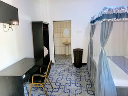 Standard Room with Fan, including breakfast for two people, bedroom fridge, 32" smart TV,  King size mosquito tent & internet
