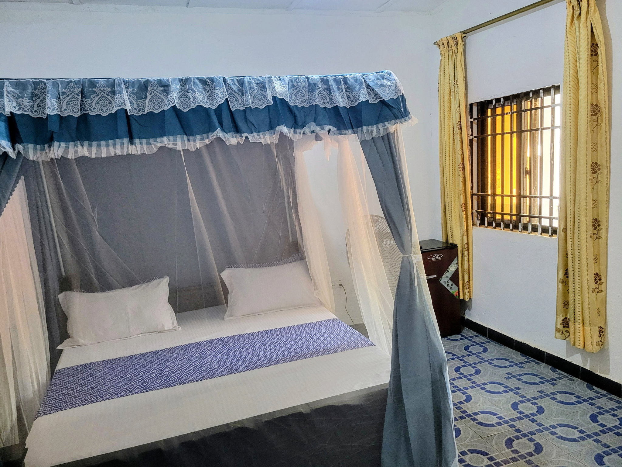 Standard Room with Fan, including breakfast for two people, bedroom fridge, 32" smart TV,  King size mosquito tent & internet_5