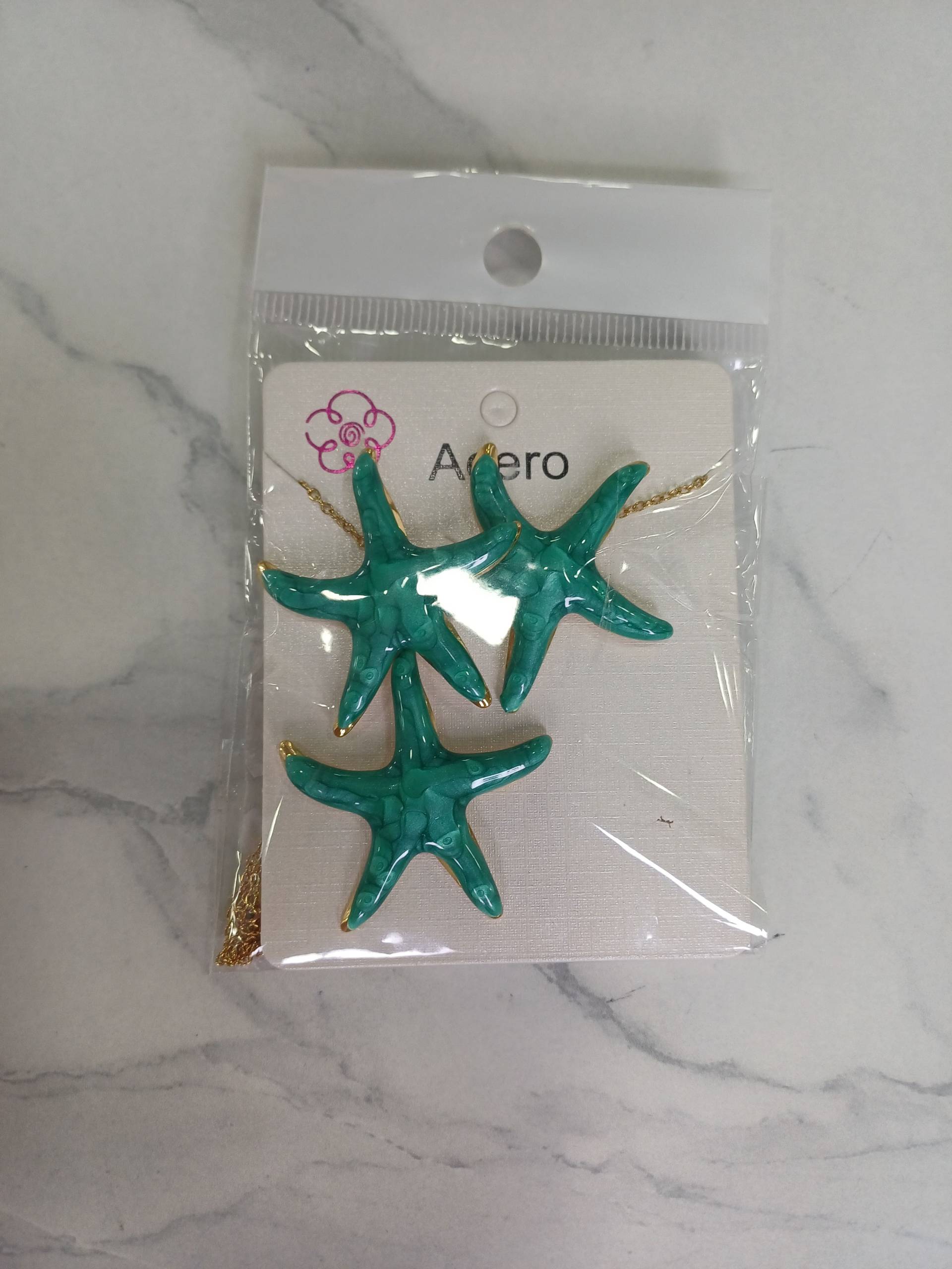 Conjunto de pendientes y colgante de estrella_0