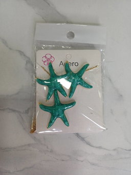 Conjunto de pendientes y colgante de estrella