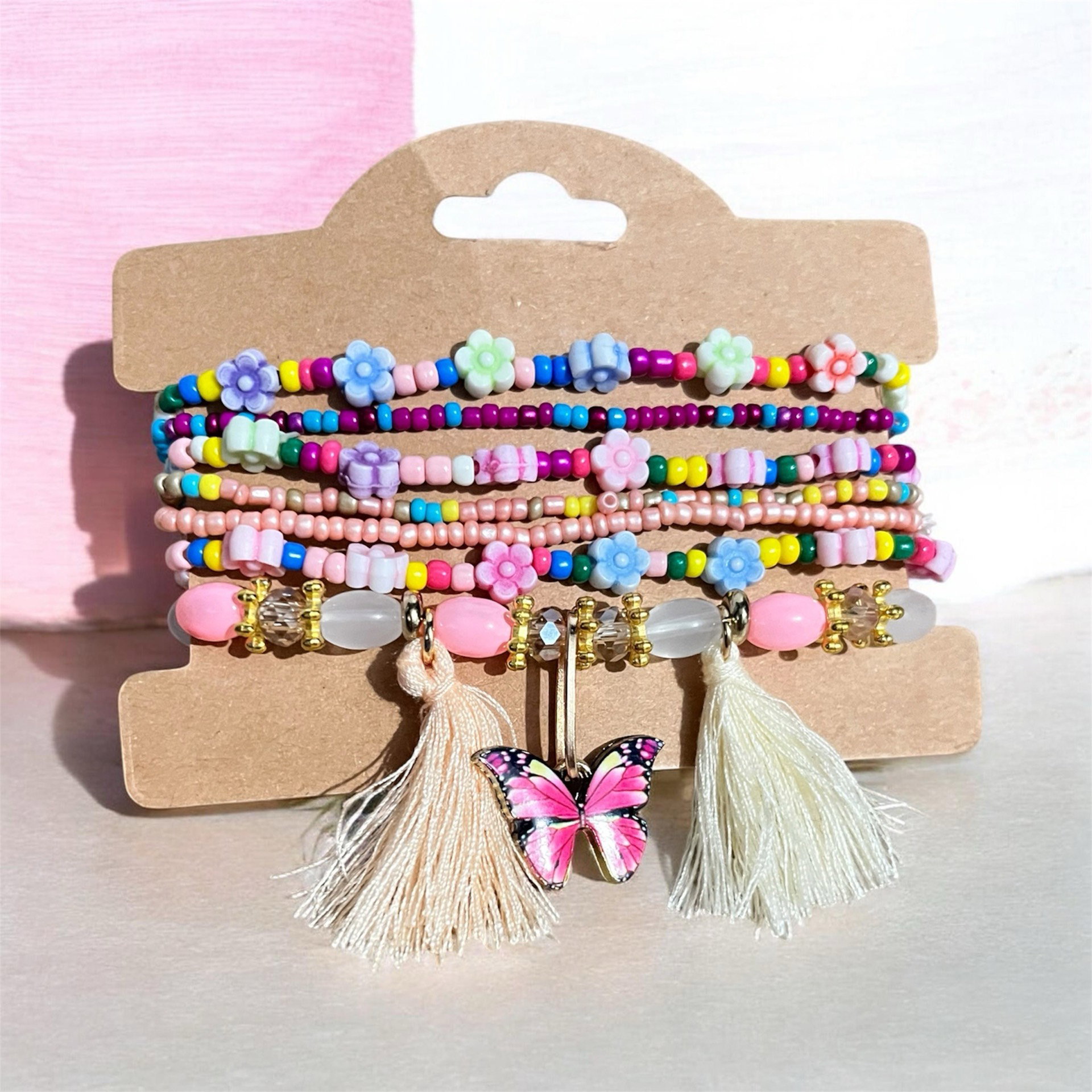 Set 7 pulseras con pompón_0