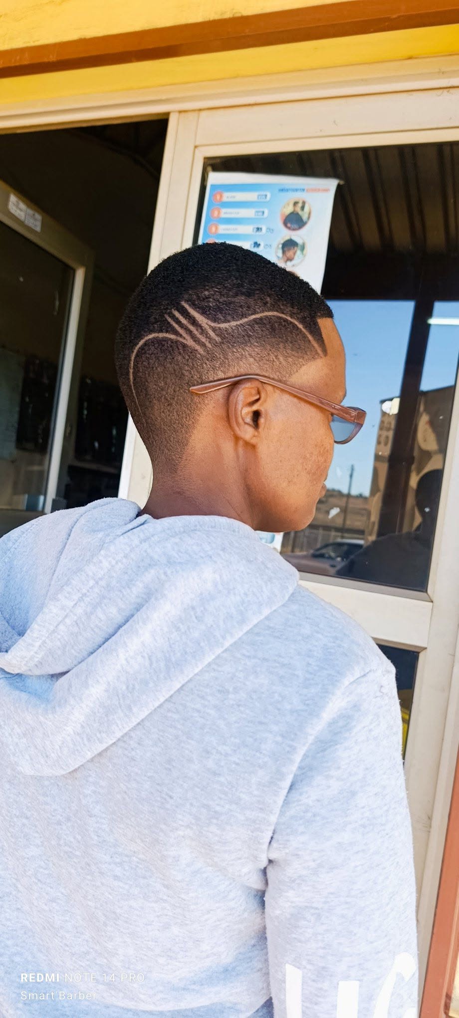 Short Taper Fade with Freestyle Razor Design Lines_0
