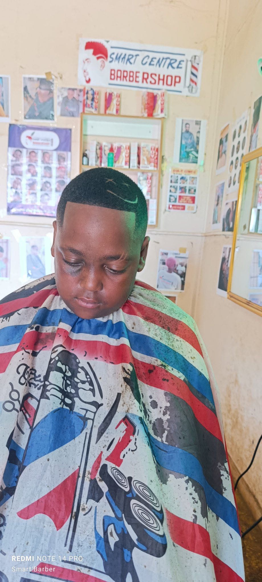 Crisp High Skin Fade with a "Smiley Face" Razor Design