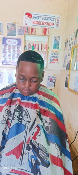 Crisp High Skin Fade with a "Smiley Face" Razor Design