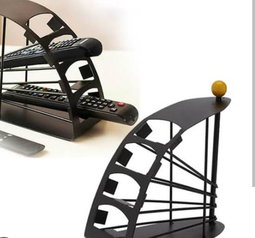 A tiered, metal remote control organizer caddy