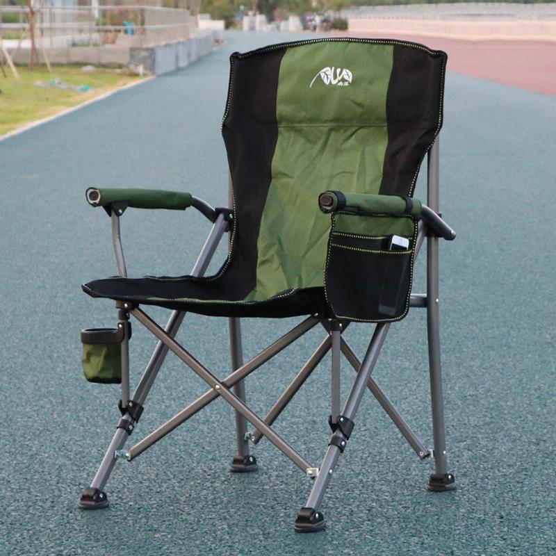 A green and black folding camping chair
