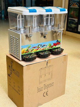 A triple-tank commercial juice dispenser, 