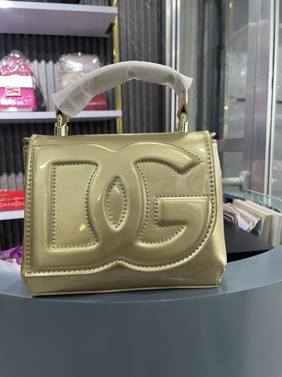Glossy Sculpted Logo Top-Handle Bag - Beige