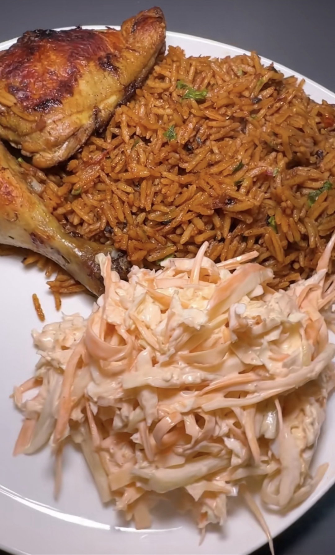 Jollof rice with chicken and coleslaw