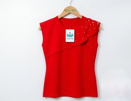 Women's black sleeveless top featuring an asymmetrical, layered design across the chest