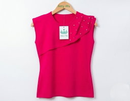 Women's black sleeveless top featuring an asymmetrical, layered design across the chest