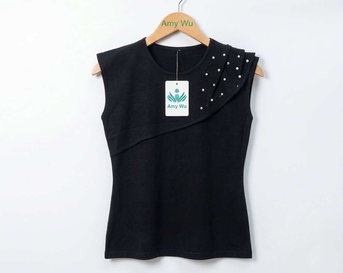 Women's black sleeveless top featuring an asymmetrical, layered design across the chest_5