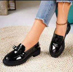 Women's black patent leather lug-sole loafers