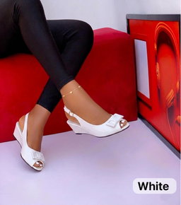 Women’s low-wedge slingback sandals sleek, patent finish