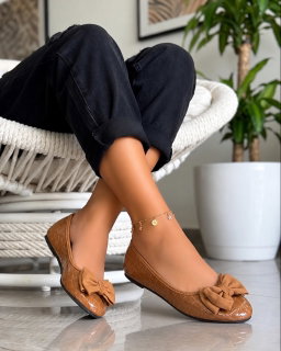 Elegant, classic ballet flats designed with feminine embellishment