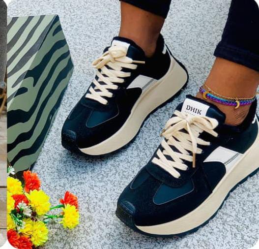 Chunky platform sneakers sporty, retro-running aesthetic._3