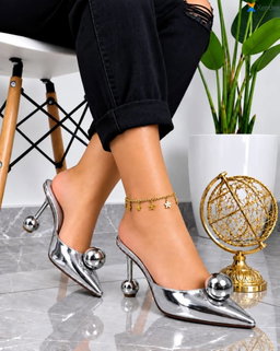 Women's patent leather pointed-toe mule heels dramatic geometric design.