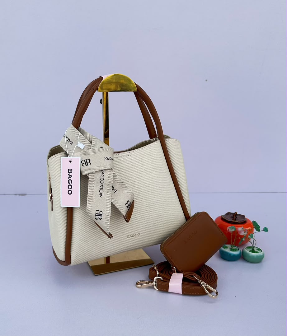 Handbag set big includes a structured tote, a compact card pouch, and a coordinating ribbon accessory._2