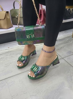 Elegant dress mules and a matching flap handbag,