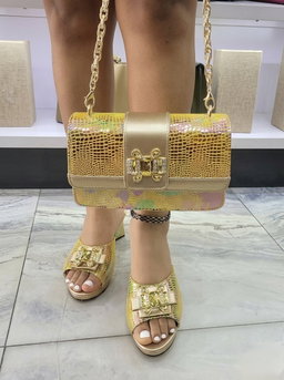 Elegant dress mules and a matching flap handbag,