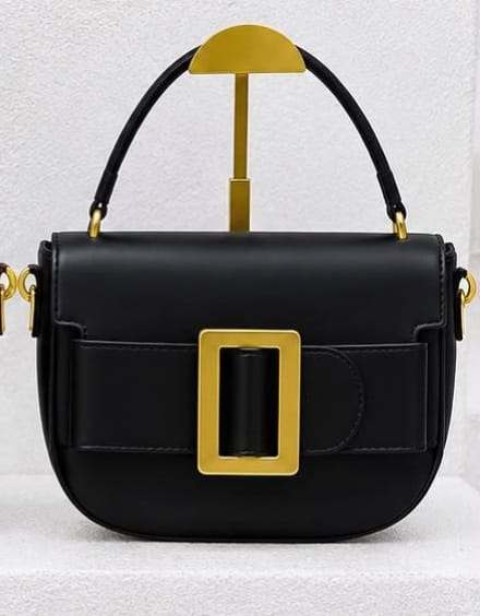 Half-moon silhouette small handbags featuring bold aesthetic._1
