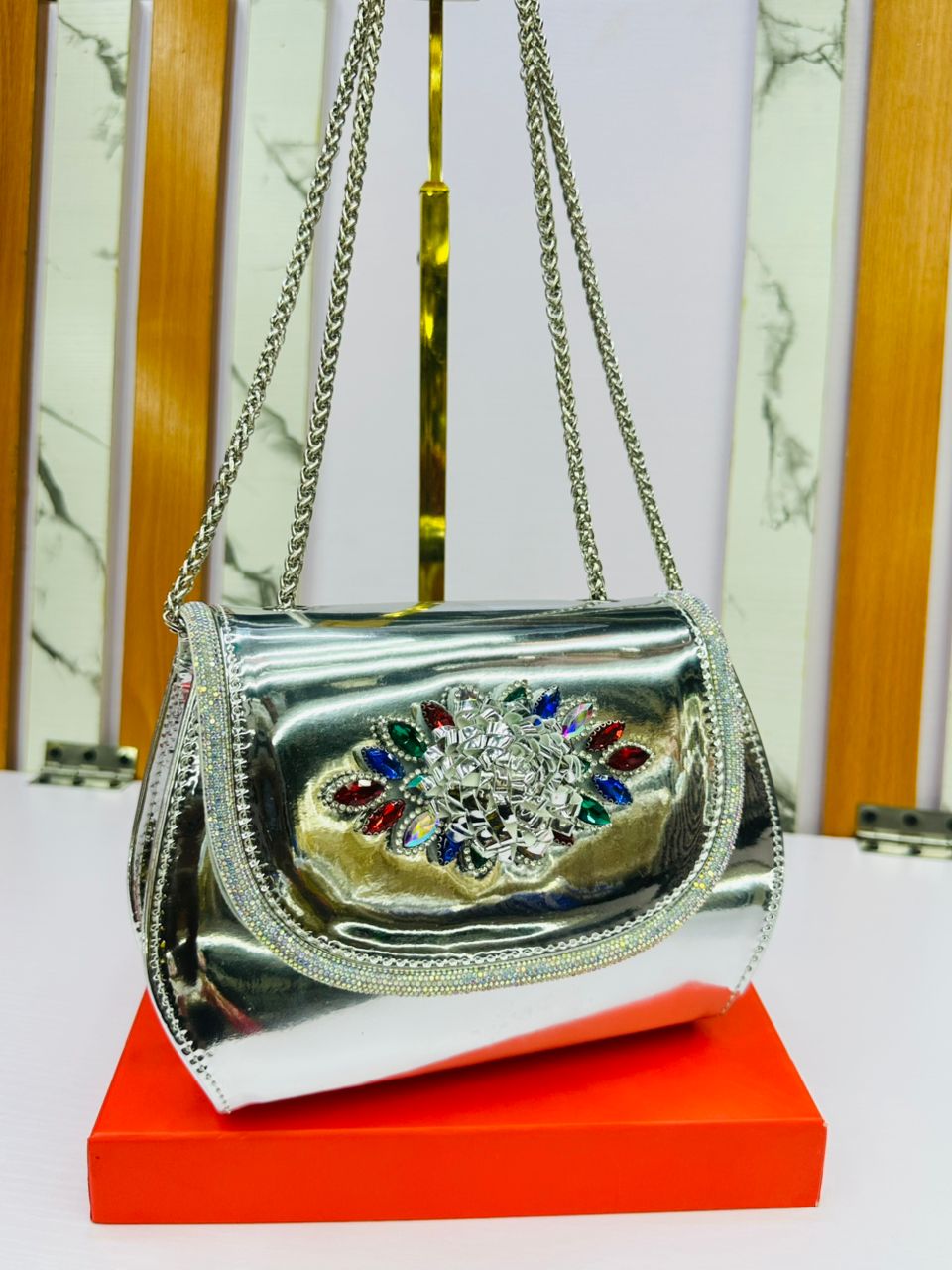 Clutch handbags  structured silhouette trapezoidal base