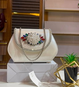 Clutch handbags  structured silhouette trapezoidal base