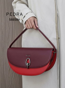 Half-moon / Curved shoulder handbag featuring a dual-tone or monochromatic leather panel design.
