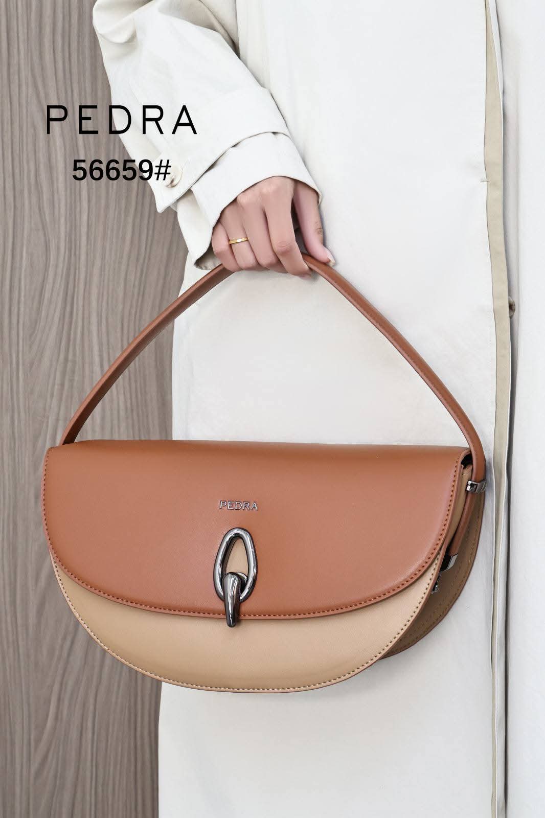 Half-moon / Curved shoulder handbag featuring a dual-tone or monochromatic leather panel design._10