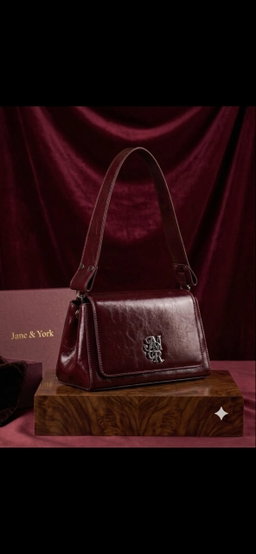 Shoulder bag / structured handbag featuring a geometric, slightly trapezoidal silhouette