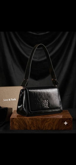 Shoulder bag / structured handbag featuring a geometric, slightly trapezoidal silhouette